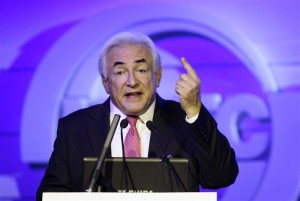 Former IMF chief Dominique Strauss-Kahn delivers a speech during an economic forum in Beijing
