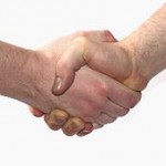 Ezrimerchant shaking hands on the (German) Wikipedia Workshop in Cologne, 2006—posing for de:Händeschütteln.